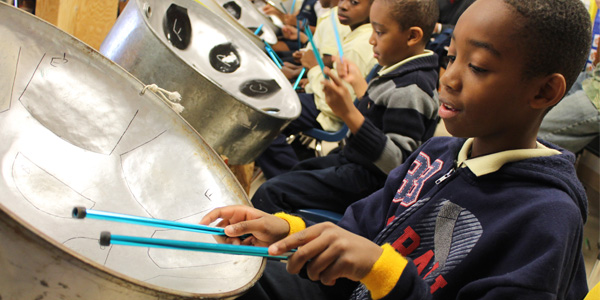 Boy playing steel drum