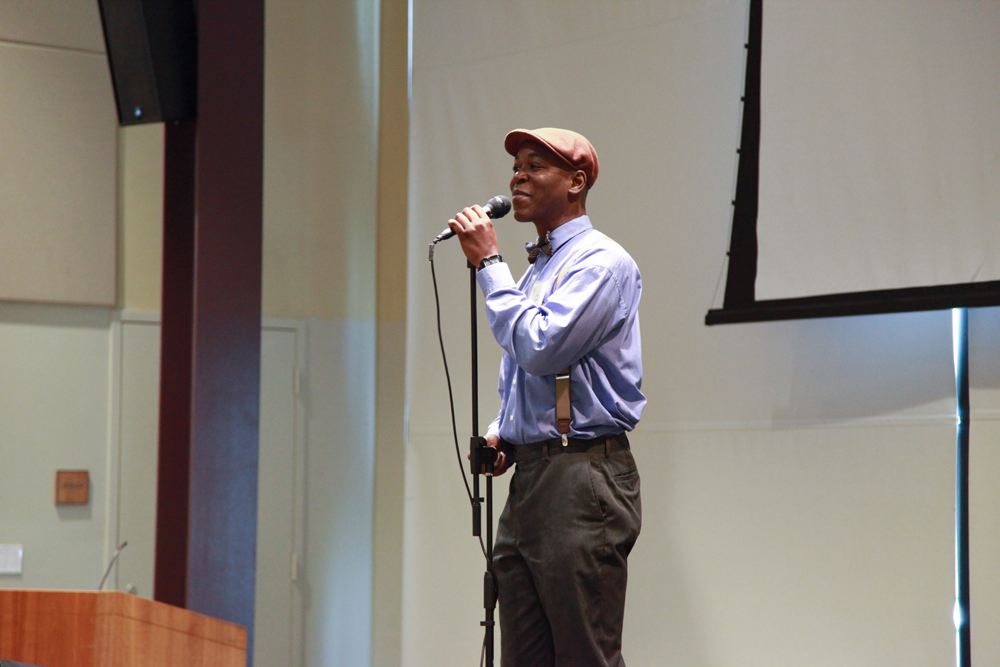 Femi the Drifish speaking at the mic.