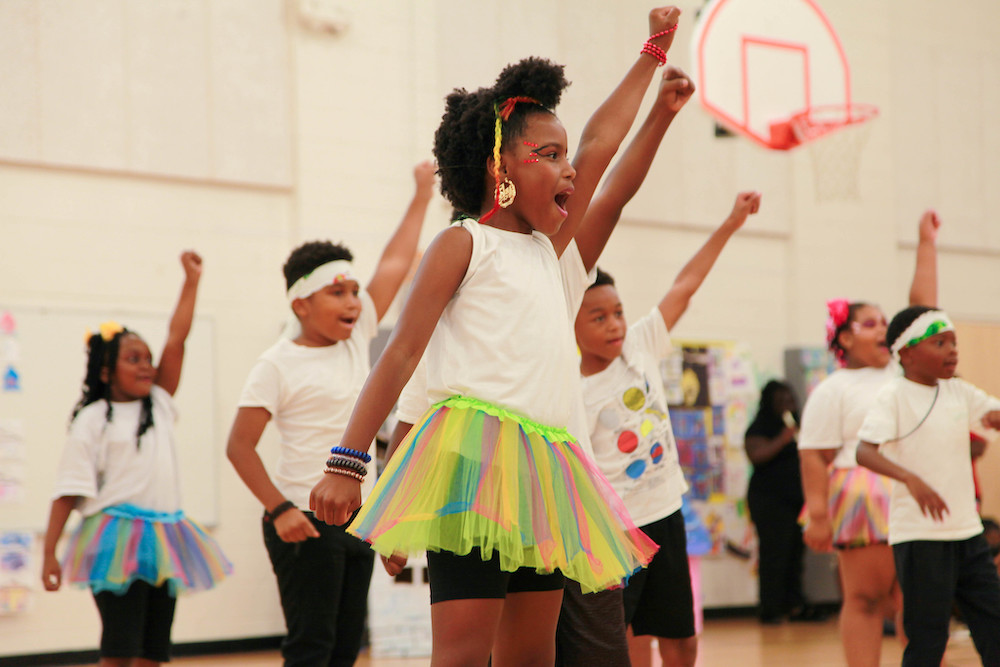 Students dancing in gymnasium